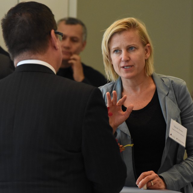 Melody Swartz discusses her science with some of the audience at a PME event.