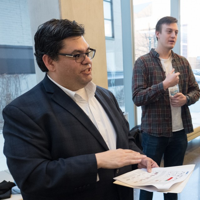 Juan Mendoza and William Grubbe explaining their science at a poster session