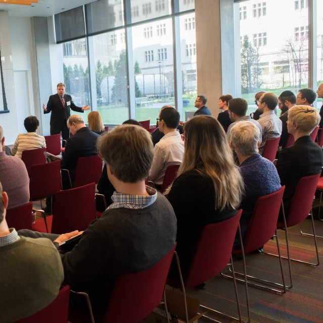 Dean Matt Tirrell giving a talk to a full seminar room