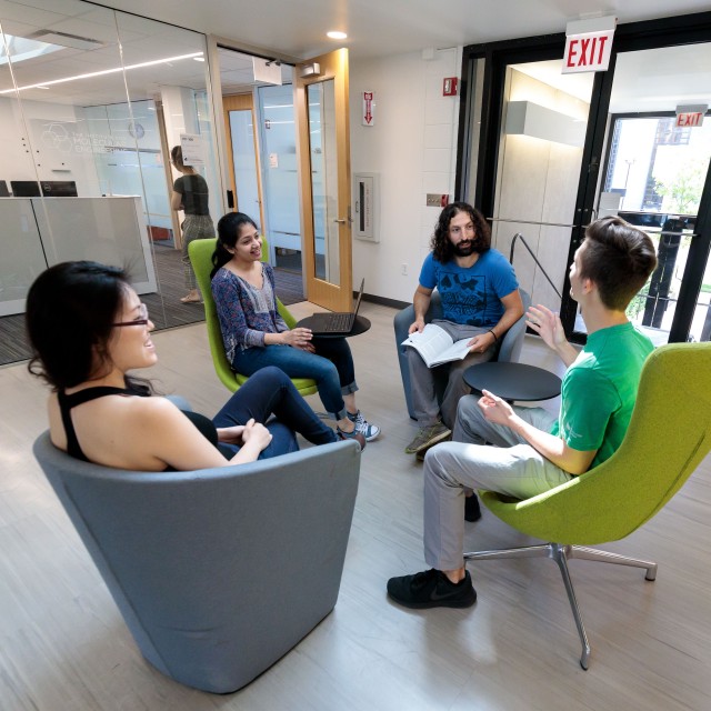 Esser-Kahn lab members Uri Zvi, Jainu Ajit, Matt Rosenberger, and Sophia Huang discussing science at a break area